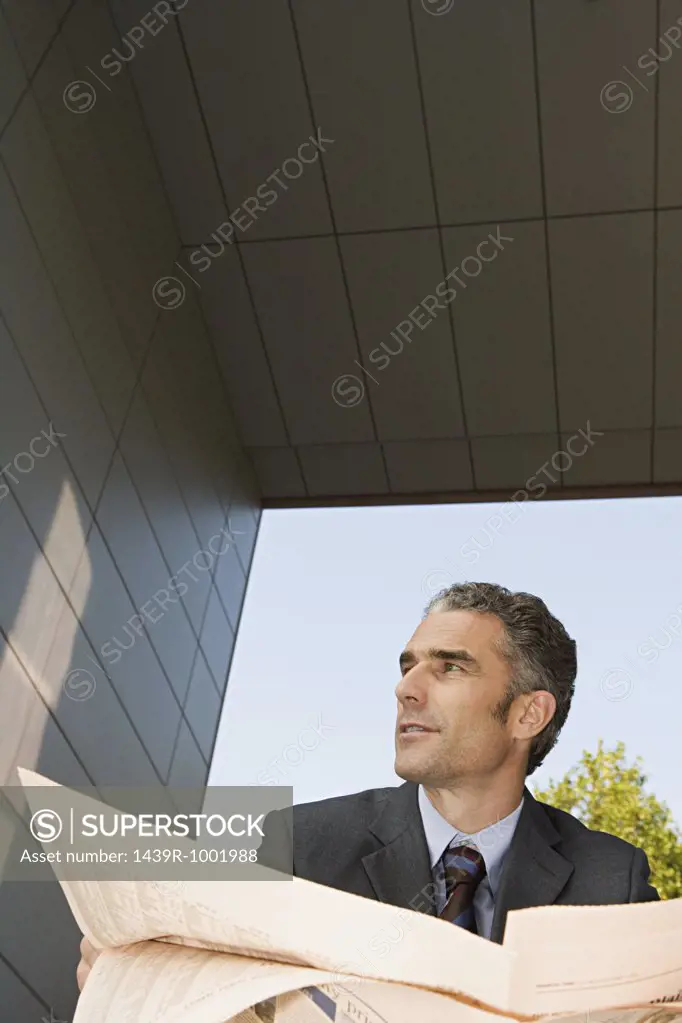 Businessman with financial newspaper