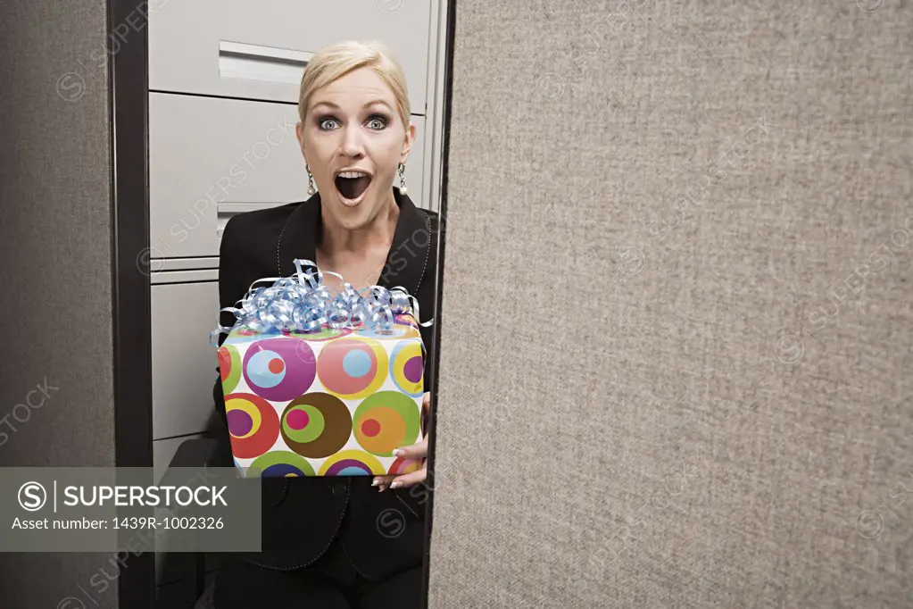 Business woman shocked by present