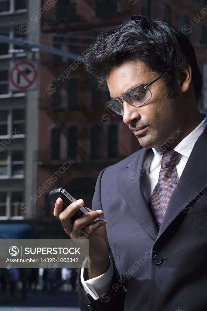 Businessman reading a text message