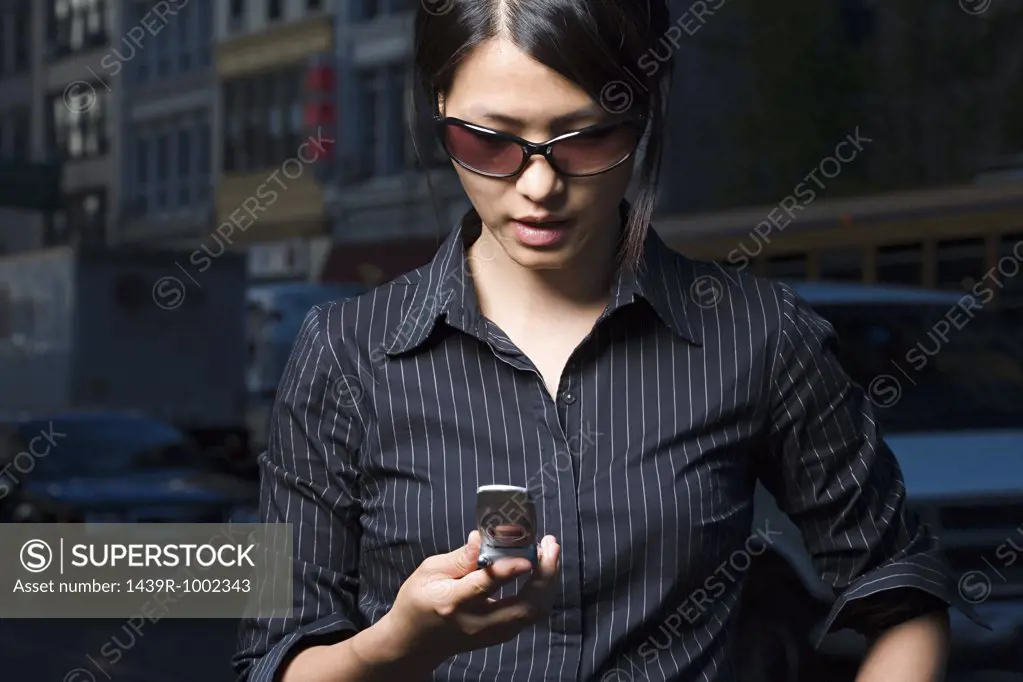 Woman looking at text message
