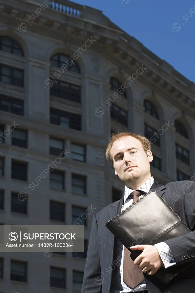 Businessman outside building
