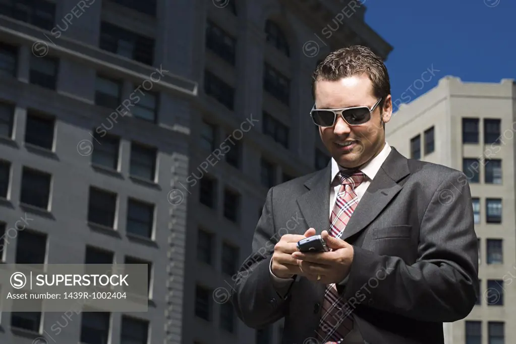 Businessman reading text message