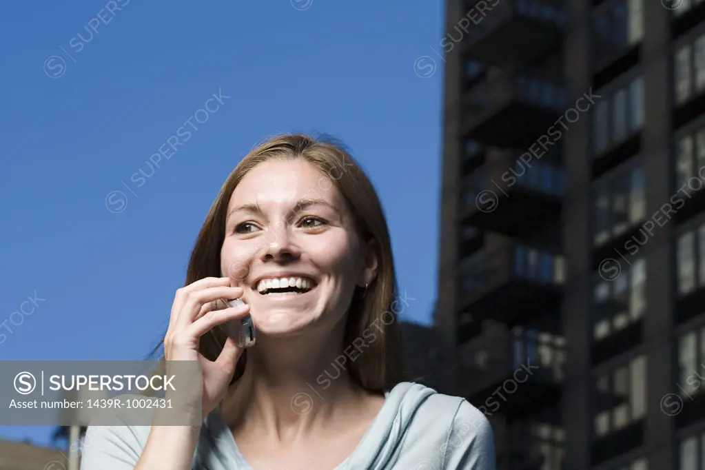 Happy woman on mobile phone