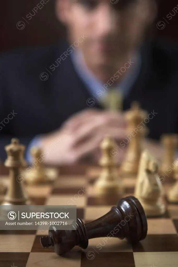 Businessman playing a game of chess