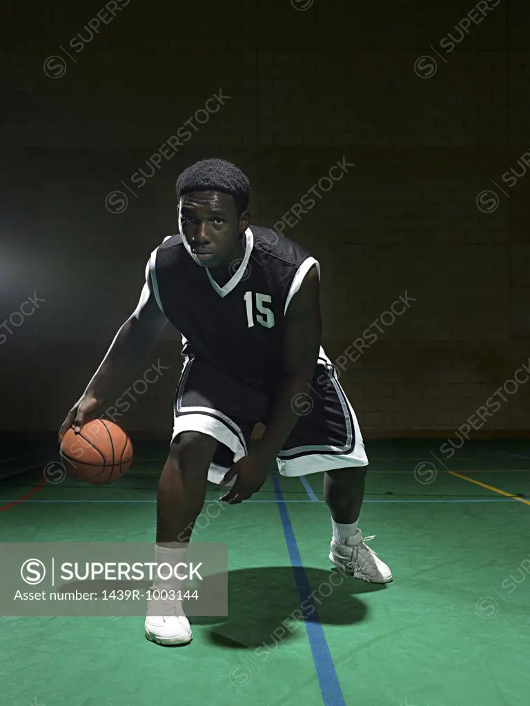 Basketball player dribbling the ball