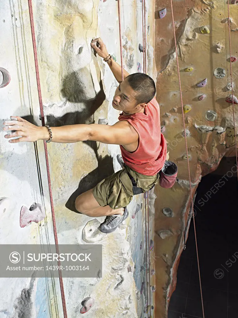 Man on climbing wall