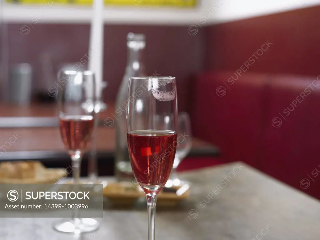 Close up of champagne glass with lipstick mark