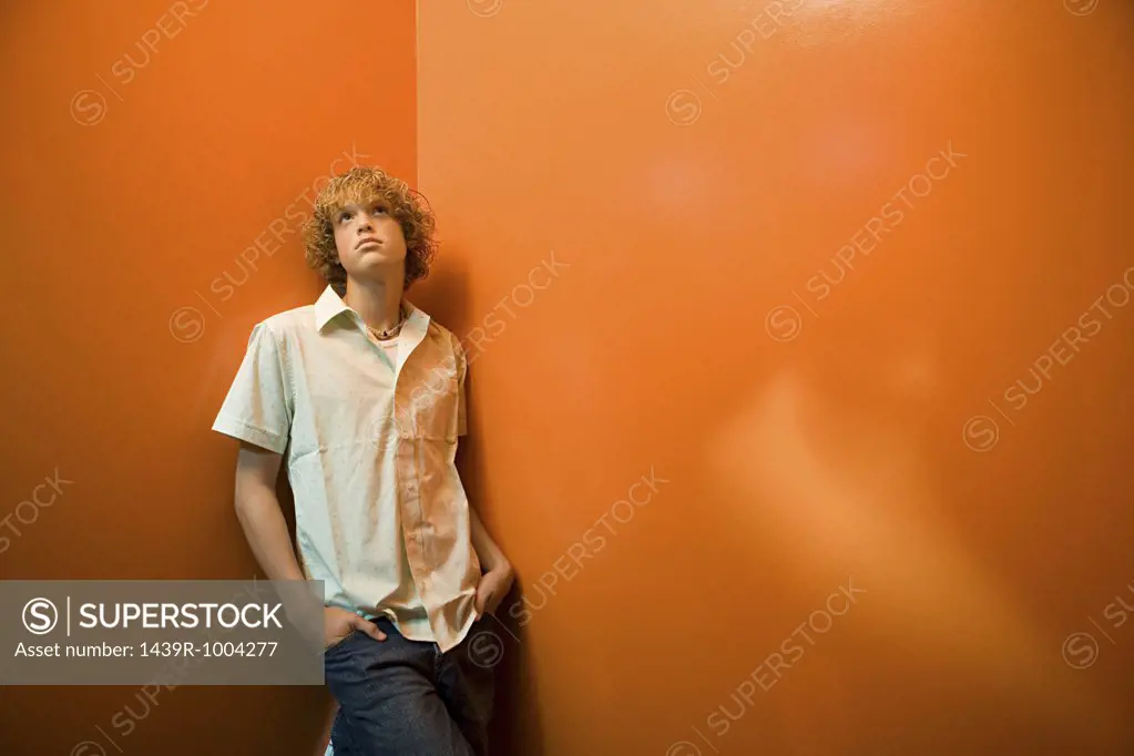 Teenage boy standing alone