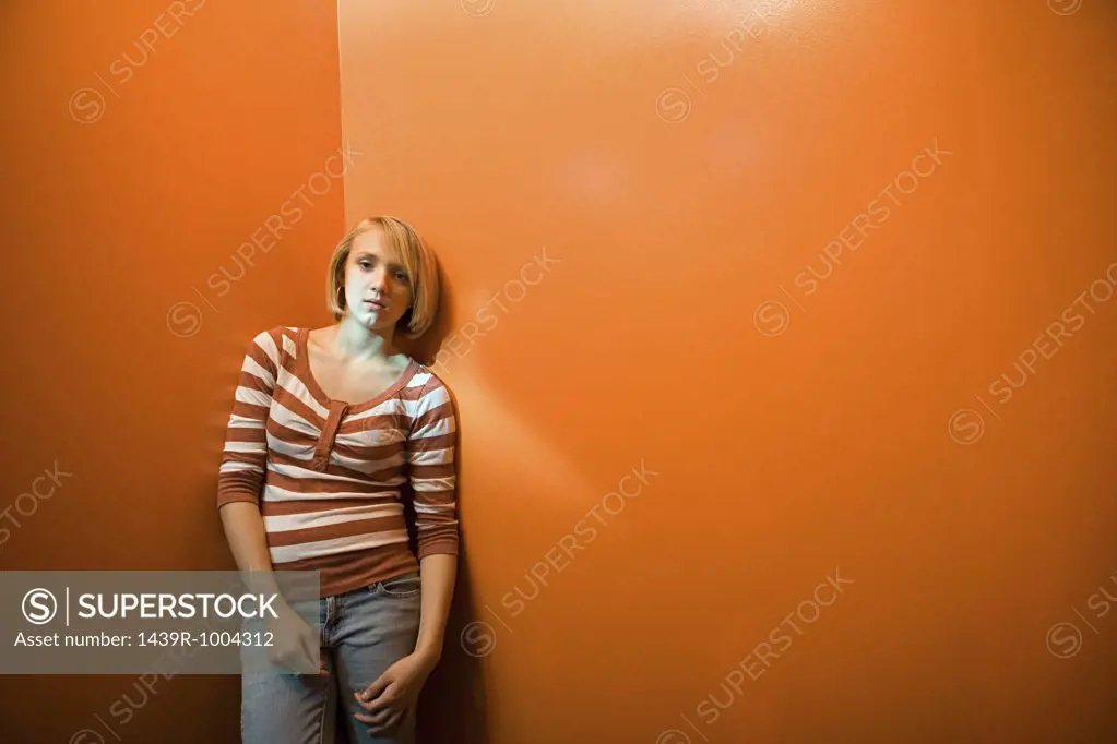 Teenage girl standing alone