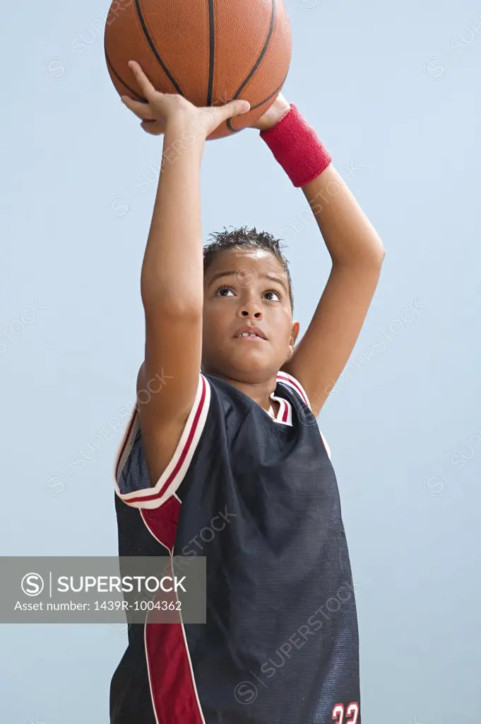 Boy about to throw basketball
