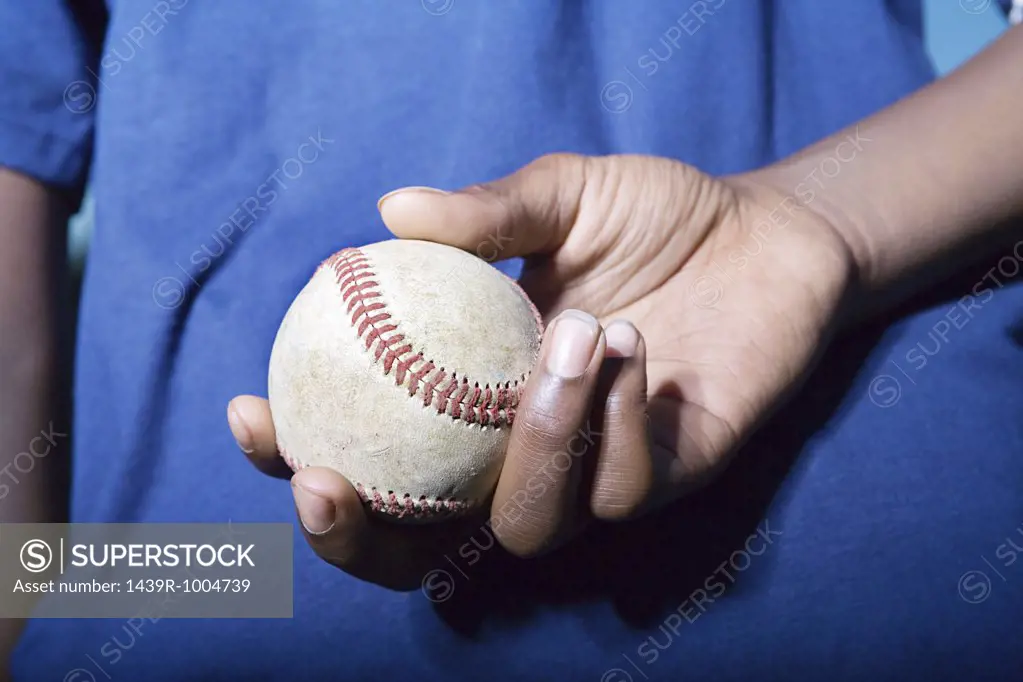 Teenage boy holding a baseball