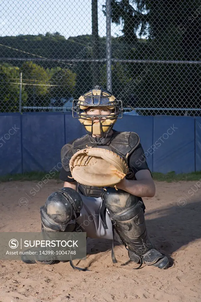 Teenage boy playing baseball
