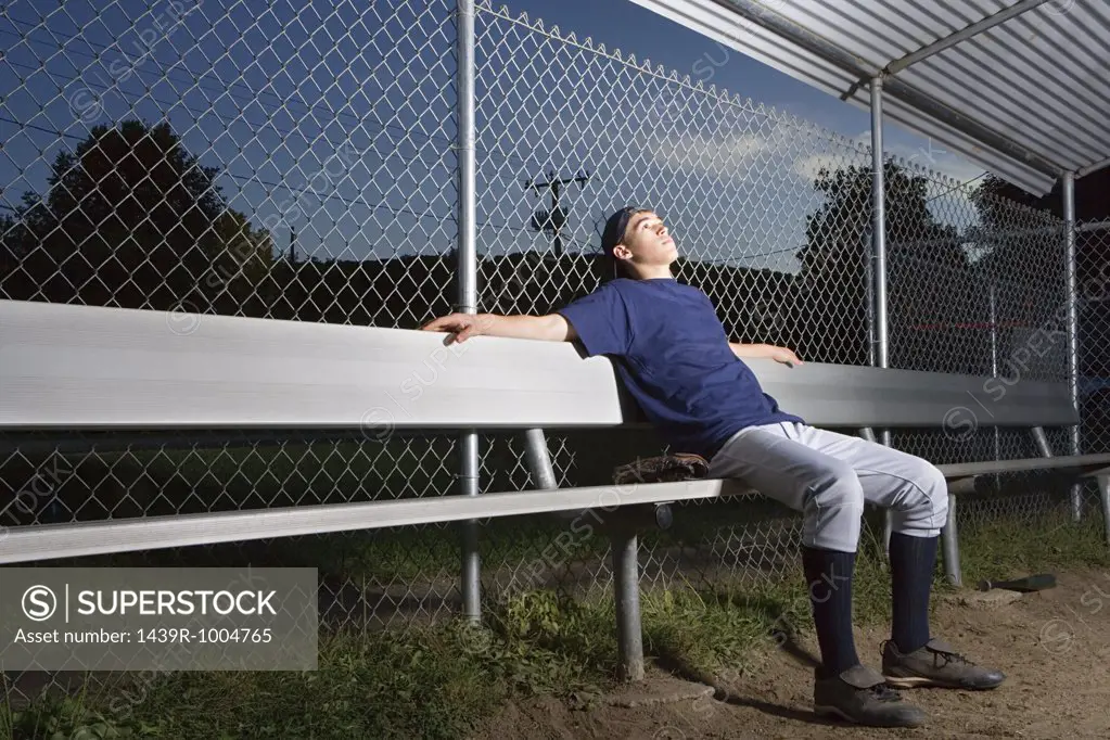 Teenage boy watching from the sidelines