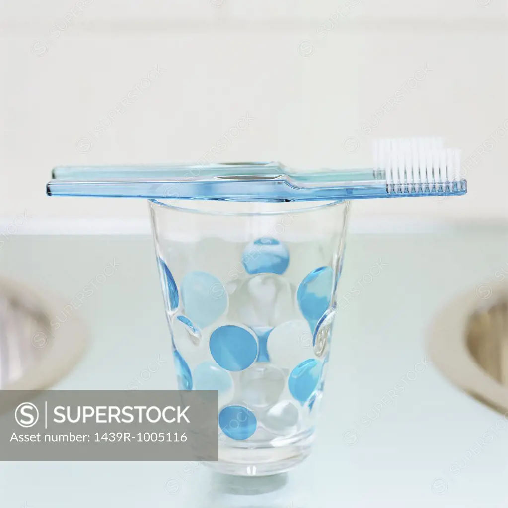 Toothbrushes on a beaker