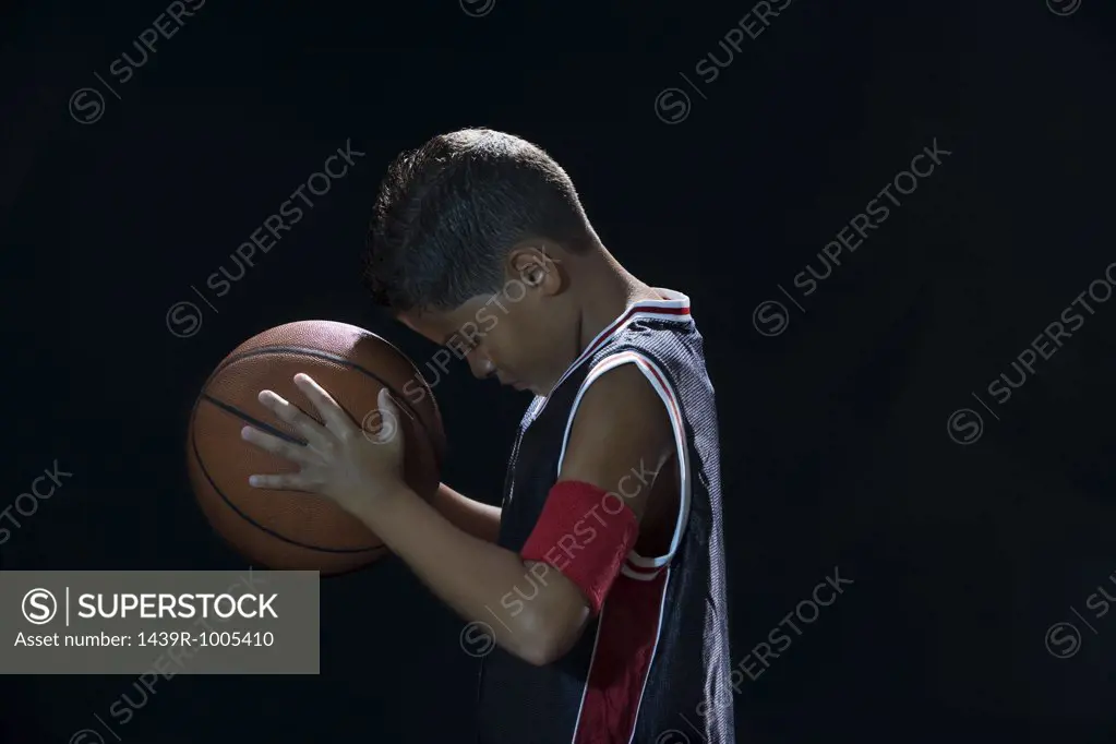 Boy holding basketball