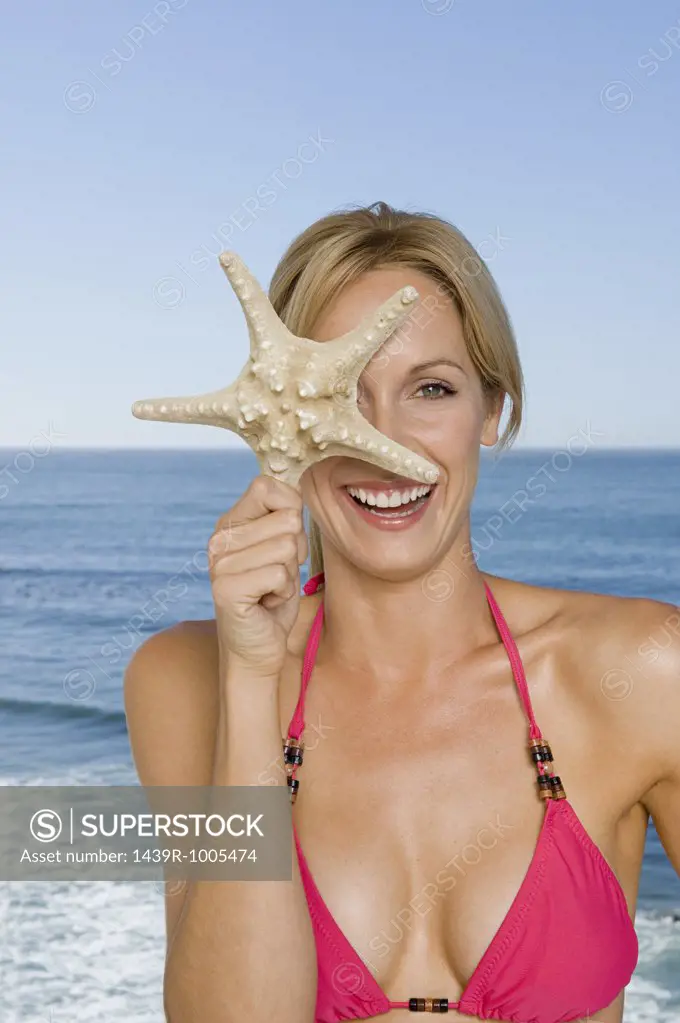 Woman holding a star fish