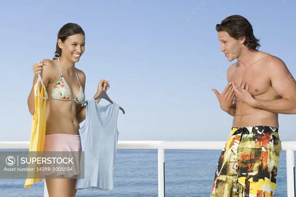 Woman showing clothing to boyfriend