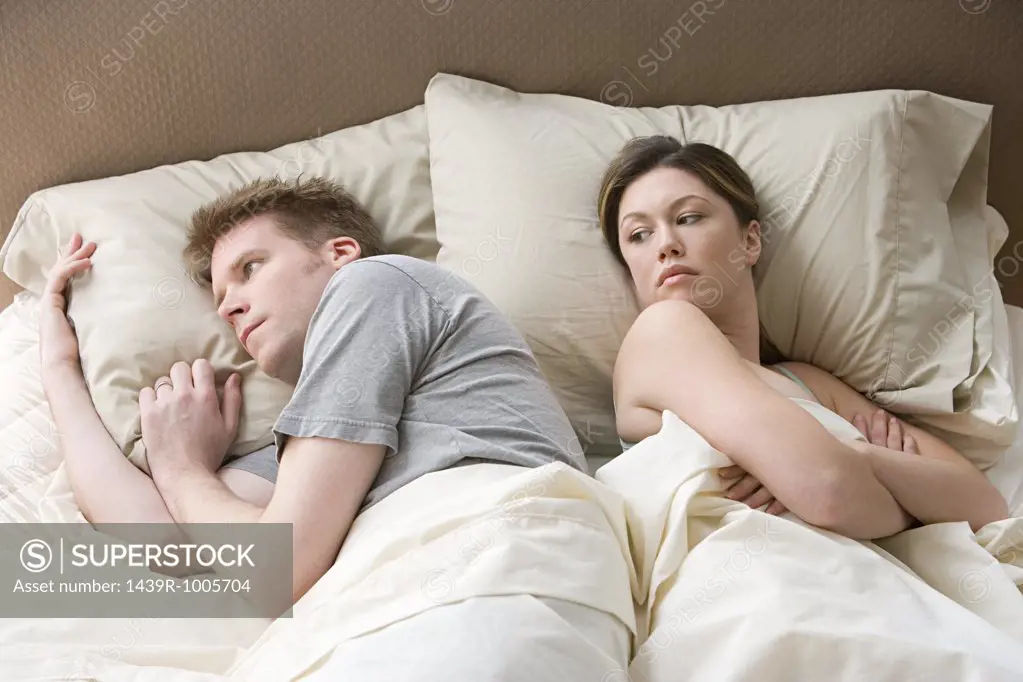 Hostile couple in bed