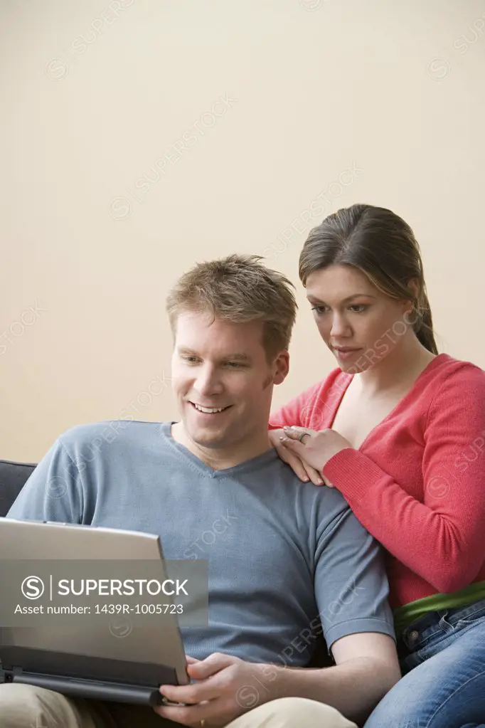 Husband and wife with laptop