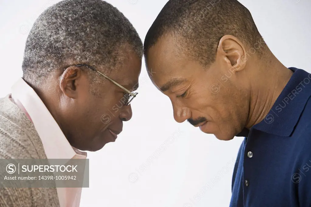 Father and son touching foreheads