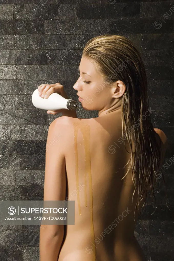 Woman using massage oil