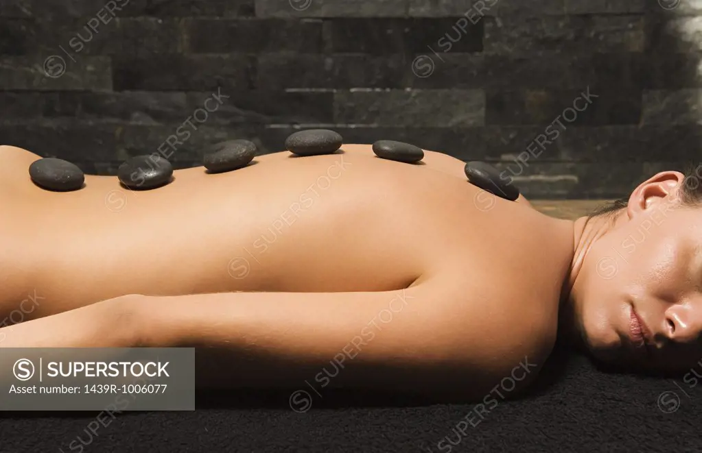 Woman having stone therapy