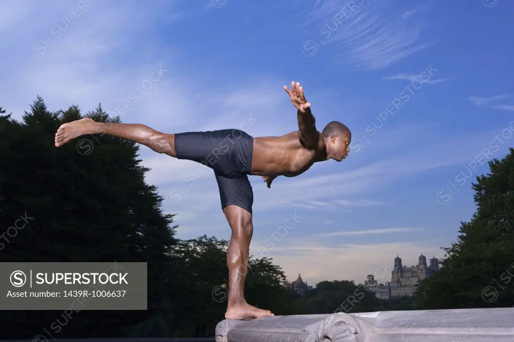 Athlete balancing on a fountain
