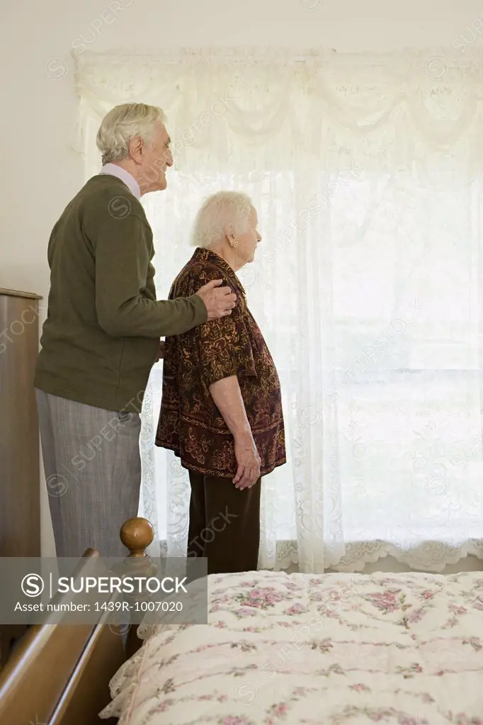 Elderly couple in bedroom