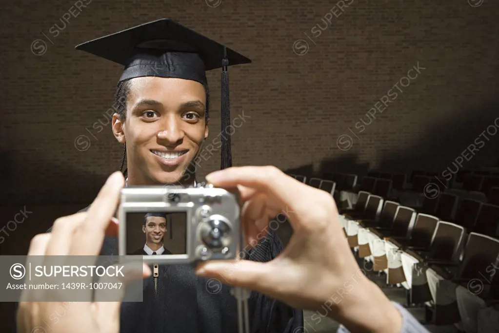Male graduate being photographed