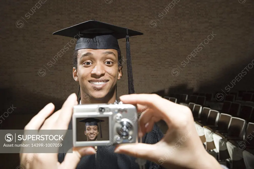 Male graduate having his photograph taken