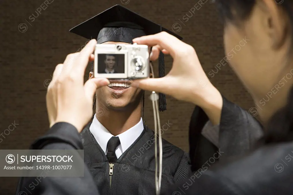 Graduates taking photographs