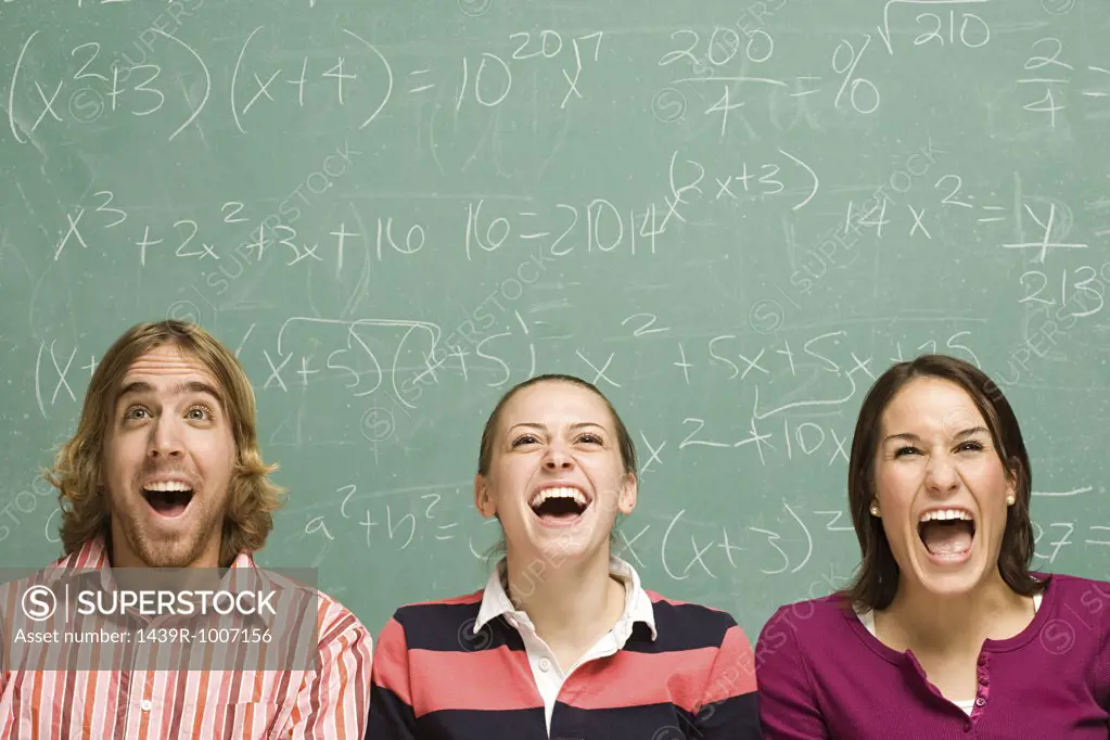 Three students laughing