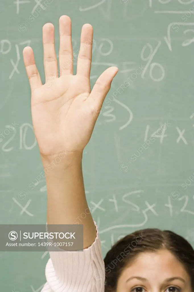Female student with her hand raised