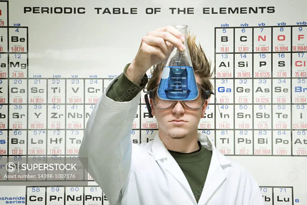Male student performing an experiment