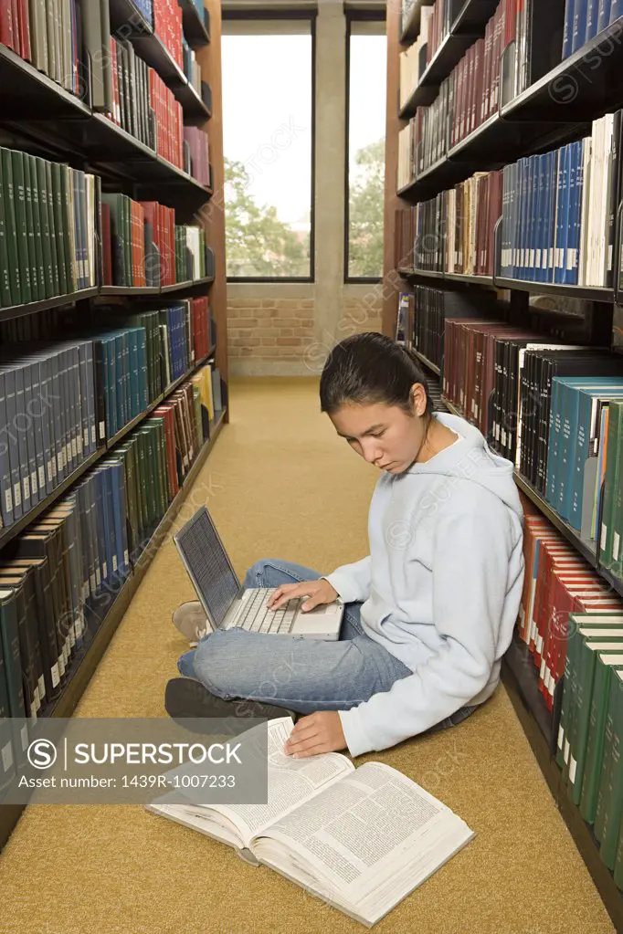 Female student working in the library