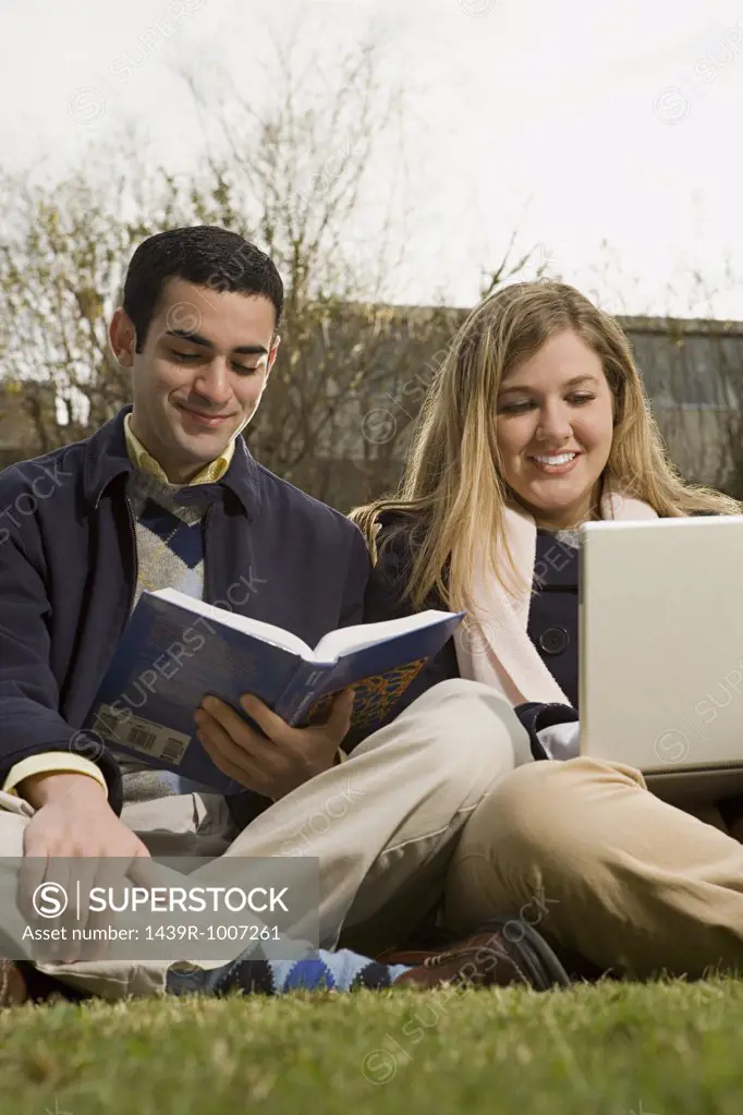 Two students studying outdoors