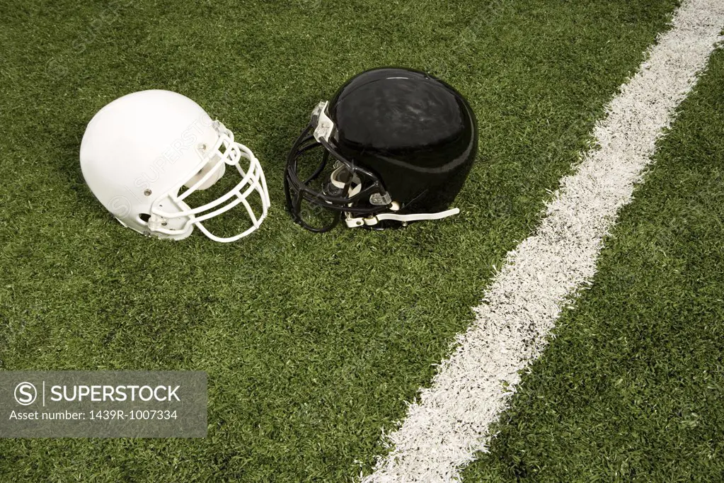 Black and white football helmets