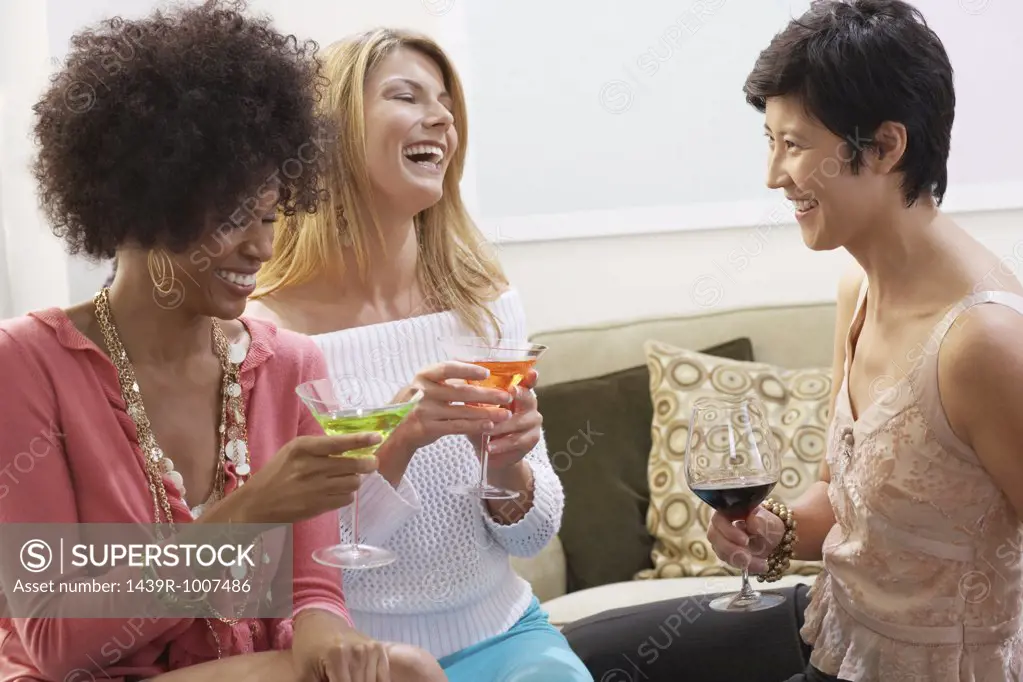 Friends having a drink and laughing