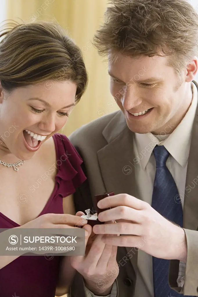 Man giving diamond ring to his girlfriend
