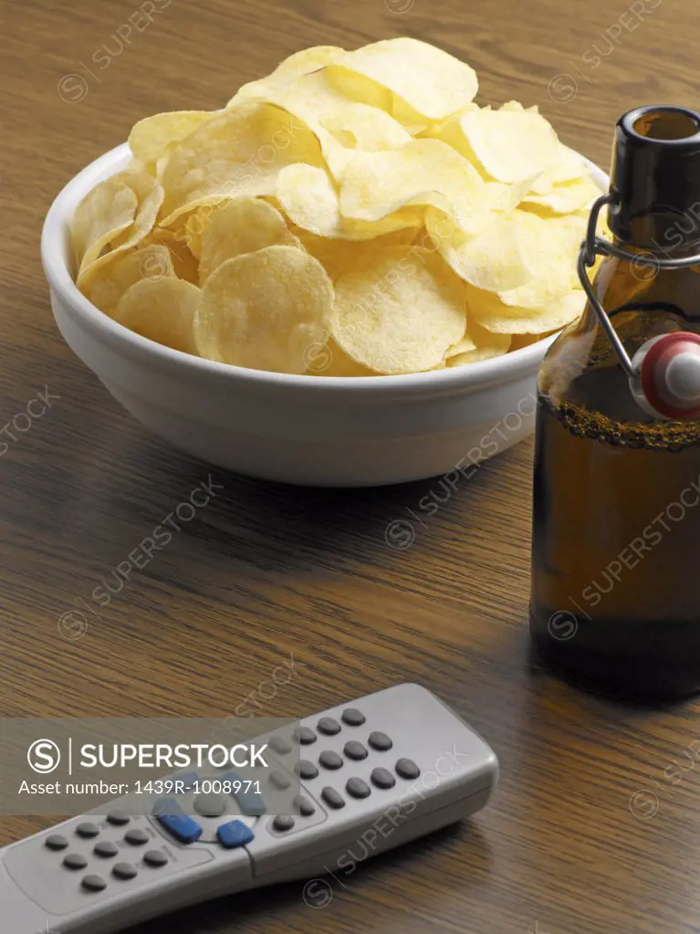 Crisps with beer and remote control
