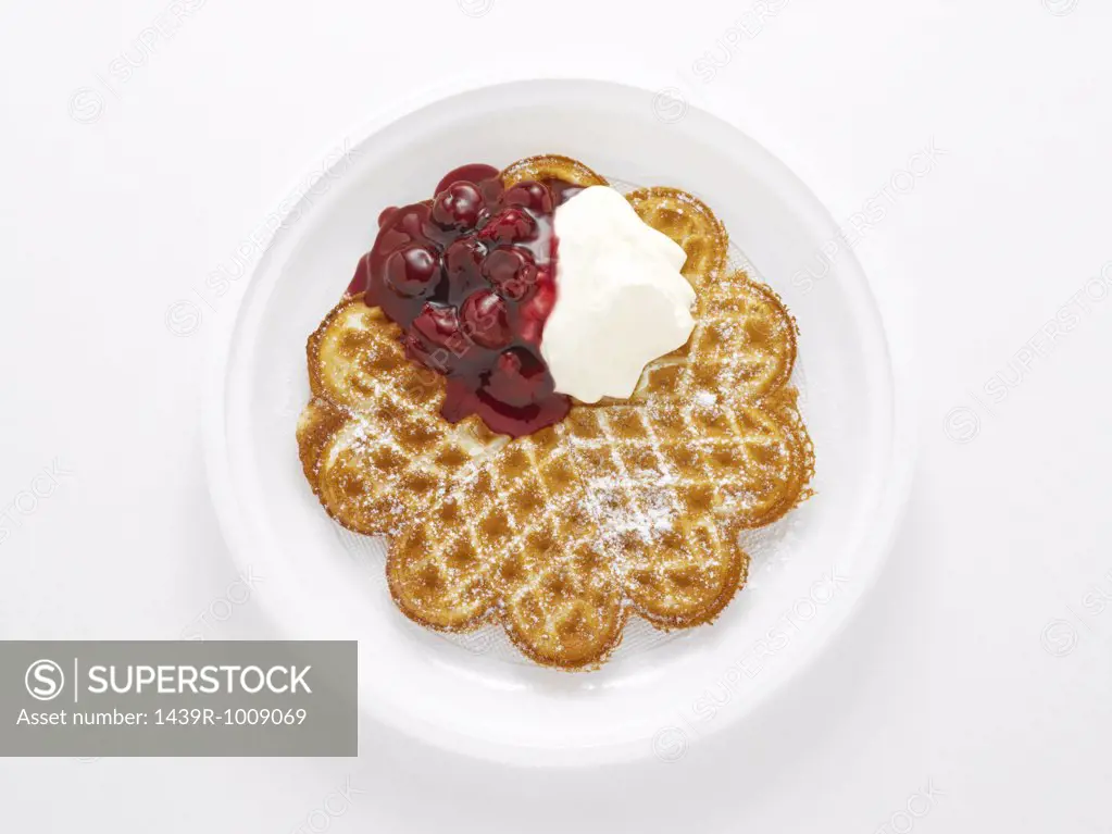Waffle with cherries and cream