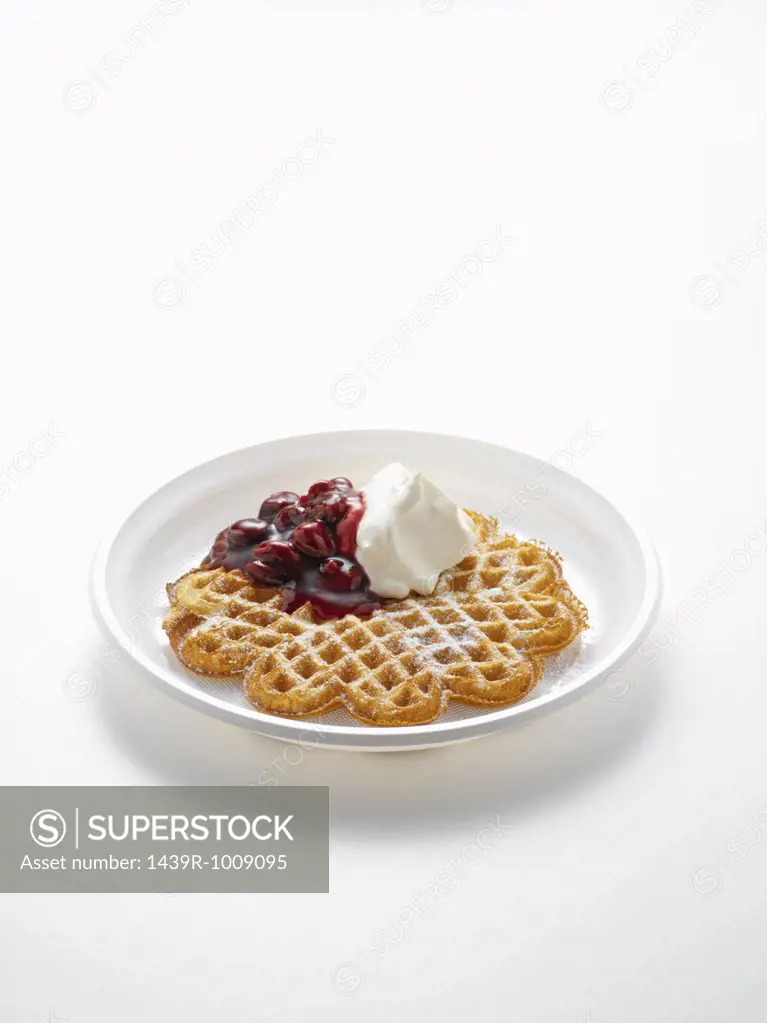 Waffle with cherries and cream