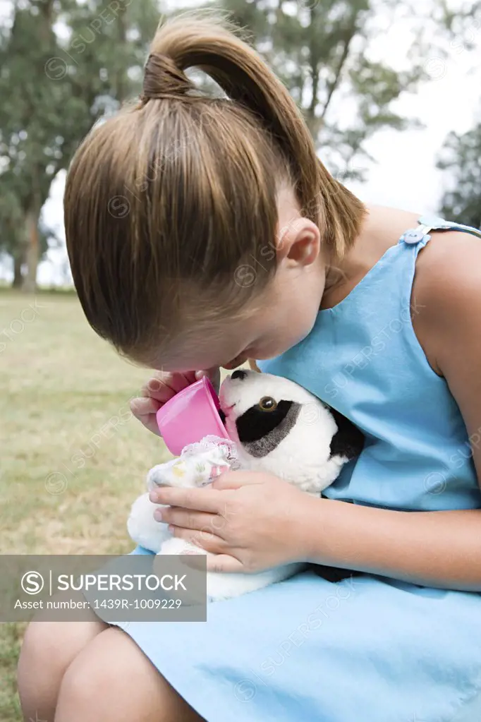 Girl playing with a soft toy