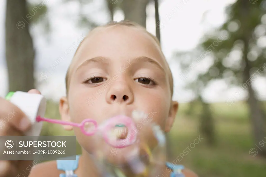 Girl using a bubble wand