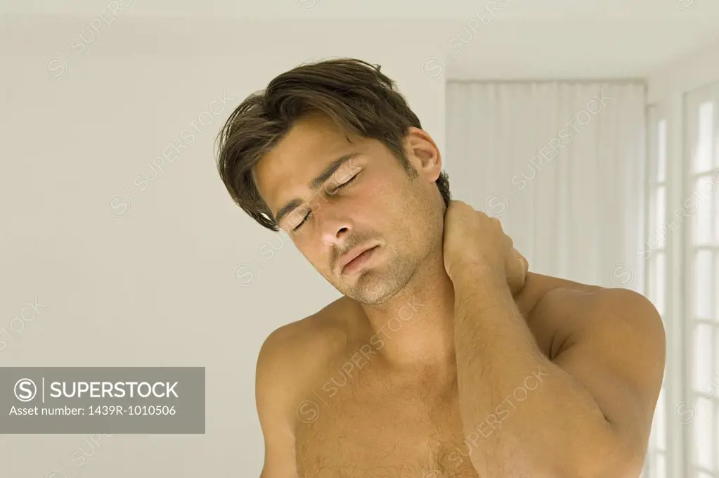 Man rubbing his neck