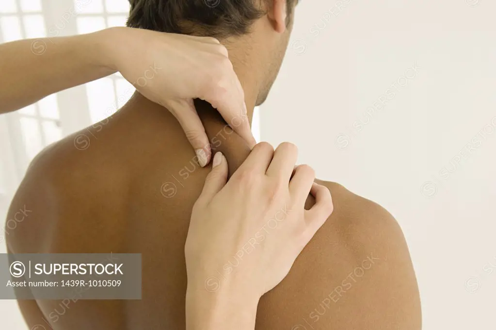 Man having his shoulders massaged