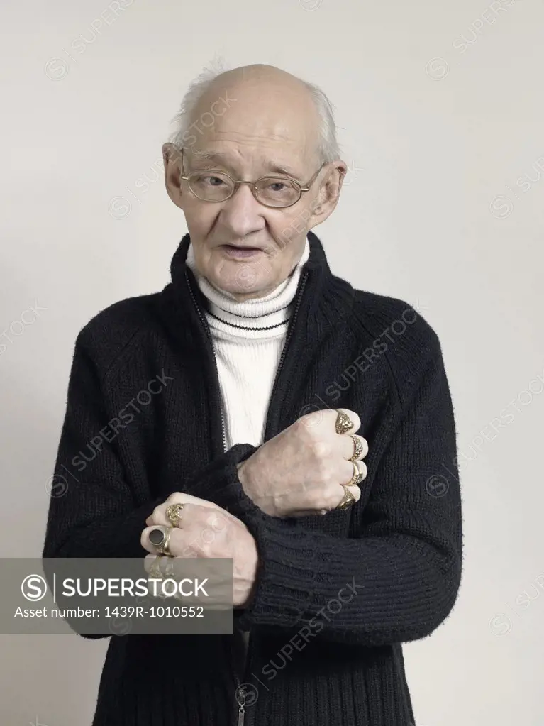 Senior man wearing finger rings