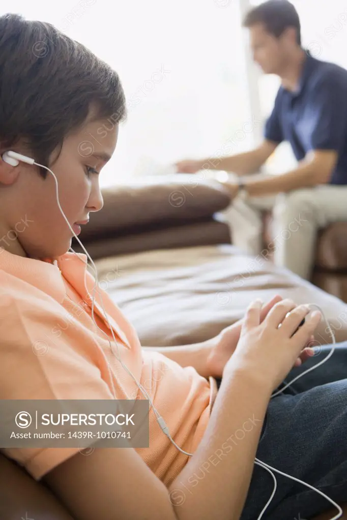 Boy listening to MP3 player