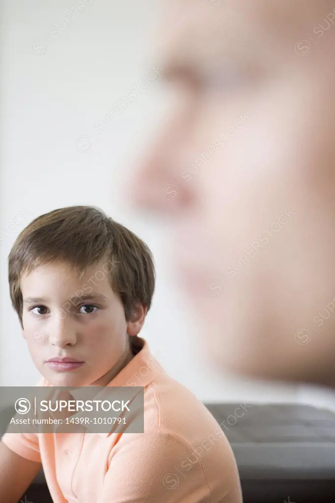 Boy and blurred father