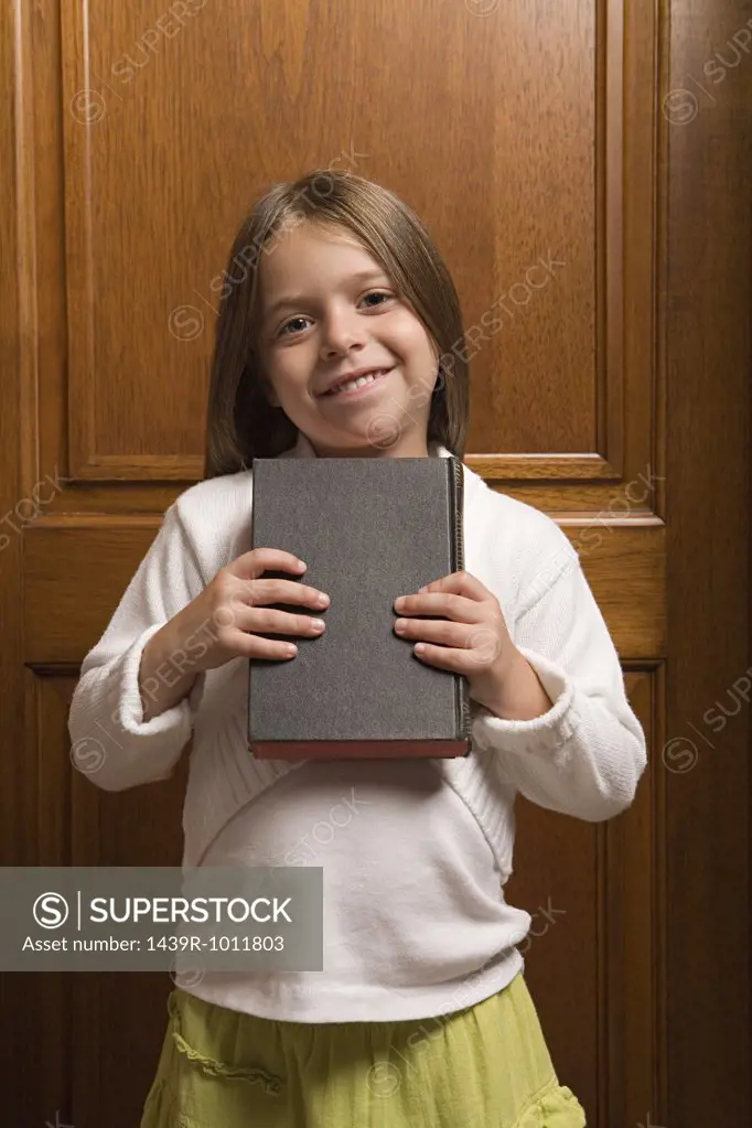 Girl holding a bible